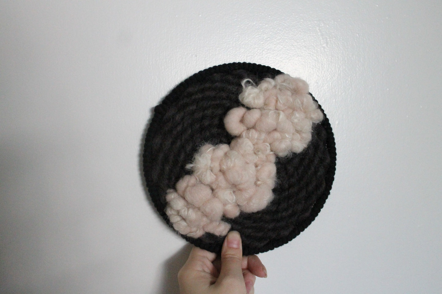 Pink and black round woven wall hanging | wall art | weaving | woven tapestry | wall decor | wall tapestry | home decor | tapestry