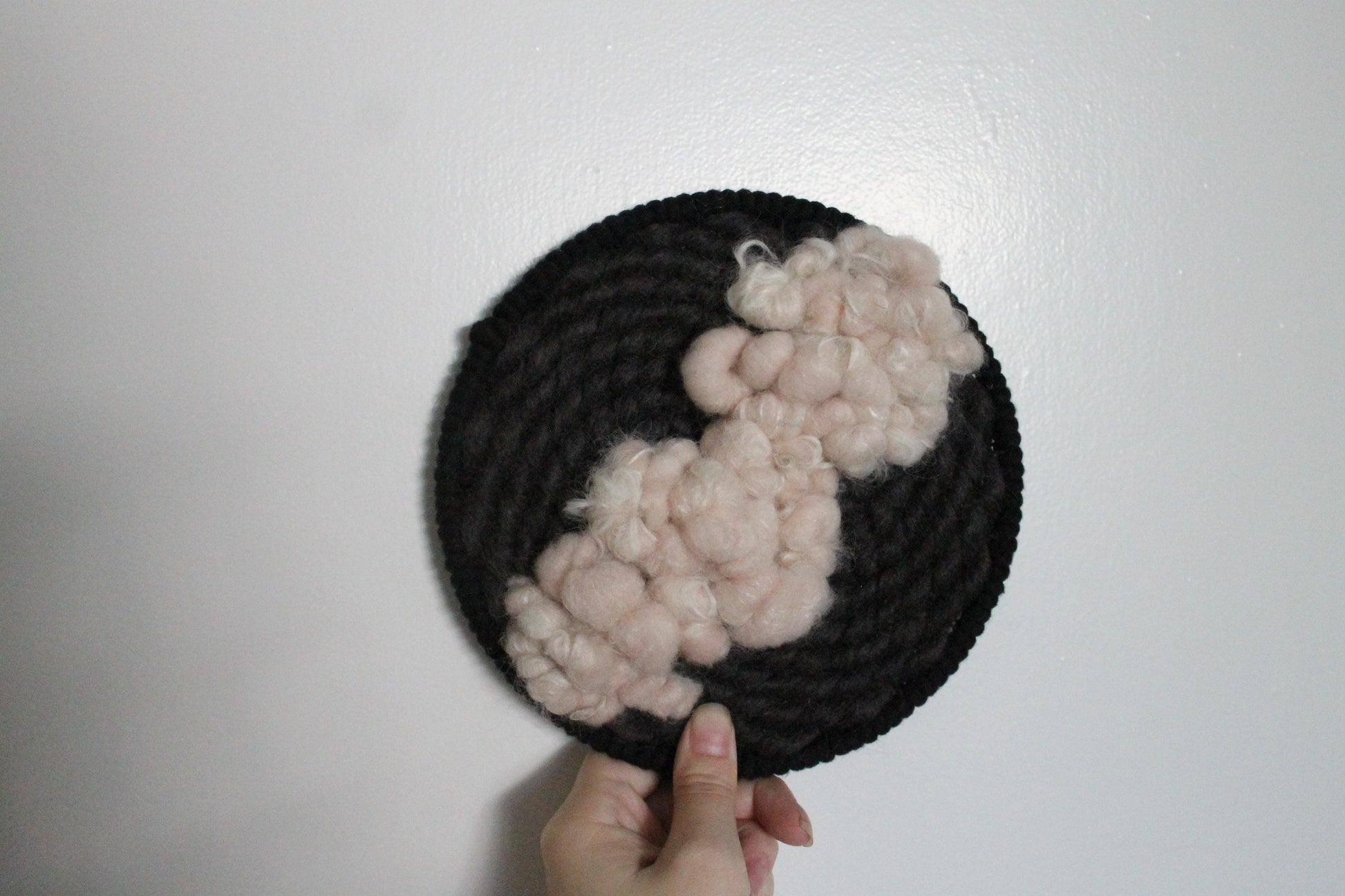 Pink and black round woven wall hanging | wall art | weaving | woven tapestry | wall decor | wall tapestry | home decor | tapestry