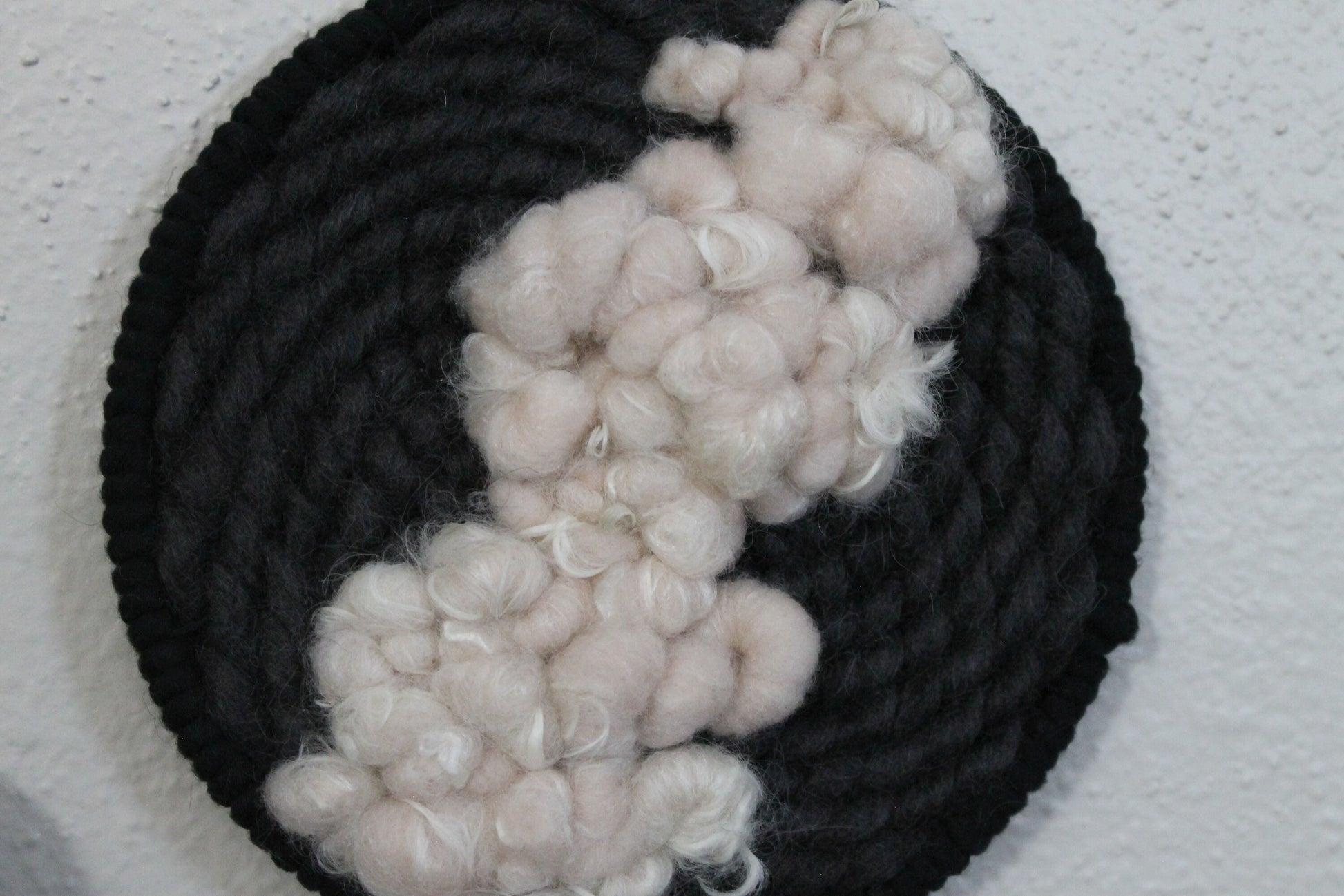 Pink and black round woven wall hanging | wall art | weaving | woven tapestry | wall decor | wall tapestry | home decor | tapestry